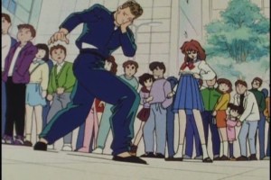 He even stands like John Travolta: as if he's a closeted-homosexual cult member