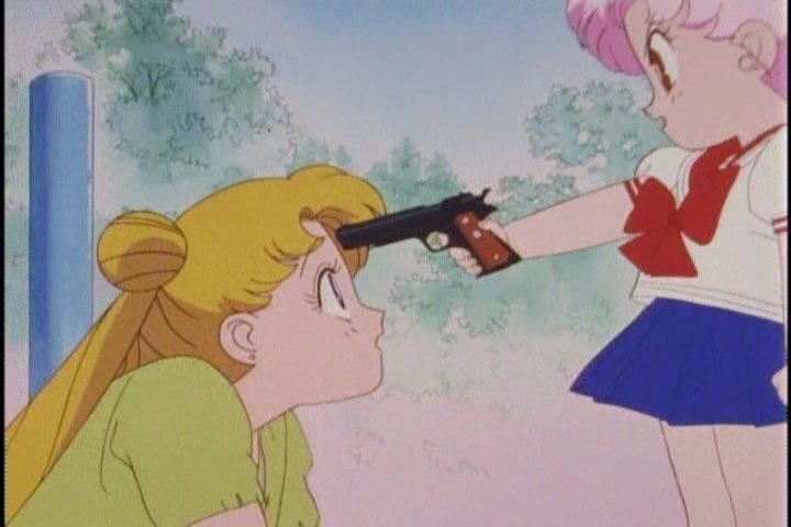 Chibi-Usa holds a gun to Usagi's head