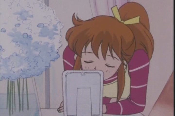 So her first kiss was with a photo frame after all. Romantic