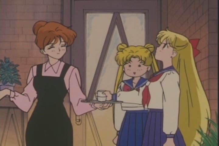 Minako shushing a waitress