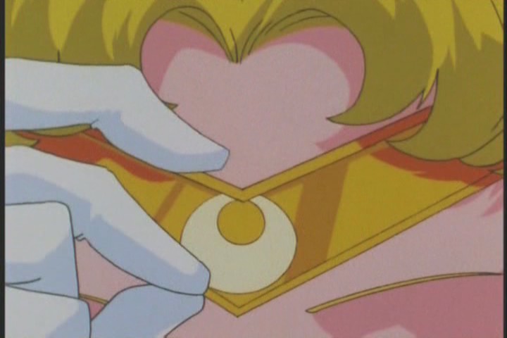 Such a nostalgic shot of Sailor Moon touching her Tiara. Just don't see it anymore!