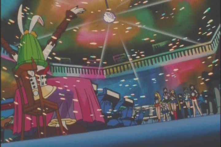 John Travolta is getting a hand-job from a waiter in the back