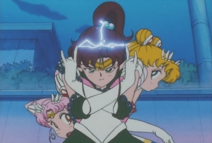Sailor Jupiter chained to Sailor Moon 